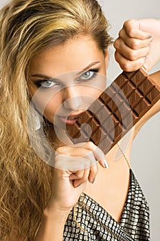 young girl with delicious milk chocolate
