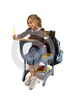 Young Girl at desk in school on white