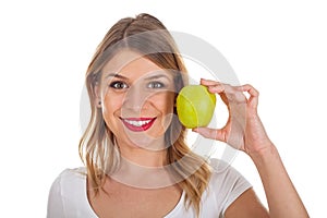 Young girl on diet holding a green apple