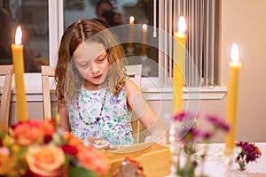 Young girl at dining table