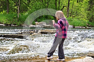 Young Girl Dipping Her Toe in the Water photo