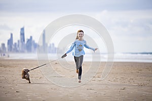 Young girl with dog on lead