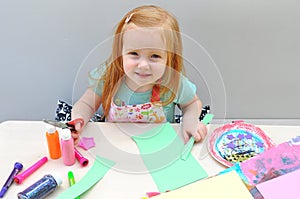 Young girl doing arts and crafts