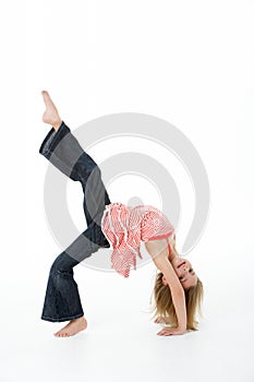 Young Girl Doing Backflip In Studio