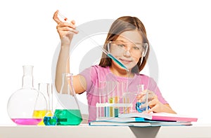 Young girl doing her chemical test in laboratory
