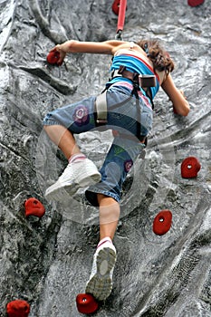 Young girl doing rock climbing