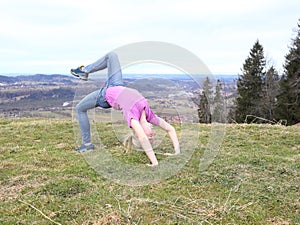 Young girl is doing a sport exercise