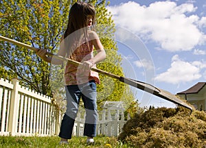 Young girl doing yardwork