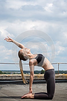 Young girl doing yoga, Camel`s Pose