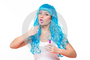 Young girl doll with blue hair. lipstick