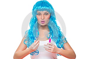 Young girl doll with blue hair. lipstick