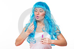 Young girl doll with blue hair. lipstick