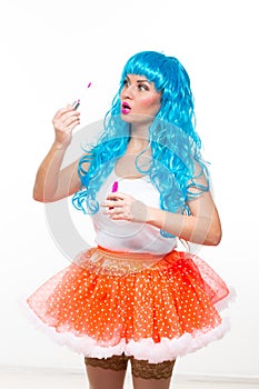 Young girl doll with blue hair. lipstick