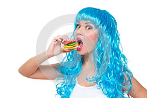 Young girl doll with blue hair. plastic eating a