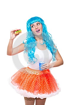 Young girl doll with blue hair. plastic eating a