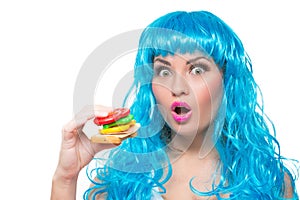 Young girl doll with blue hair. plastic eating a