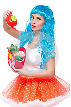 Young girl doll with blue hair. watering