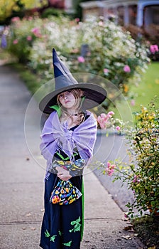 Young girl dressed as a witch at Halloween