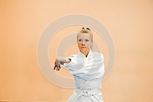 Young girl dressed in hakama practicing Aikido