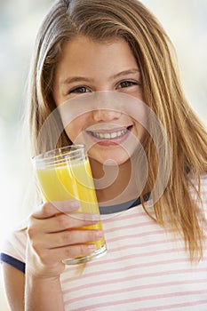 Young Girl Drinking Orange Juice