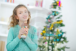 Young girl eating Christmas chocolate
