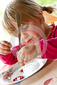 Young girl eating dinner