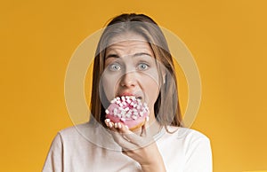 Young Girl Eating Donut, Preferring Unhealthy Food