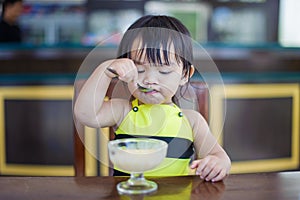 Young girl eating ice cream