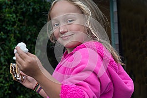 Young Girl Eating Smores Campfire Dessert