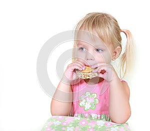 Young girl eating snacks