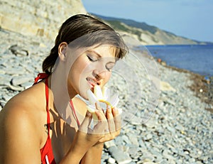 Young girl eats melon