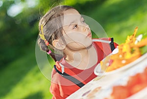 Young Girl eats vegetables