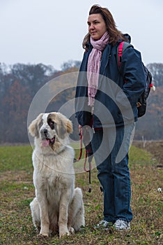 Young girl educate her Bucovina shepherd dog