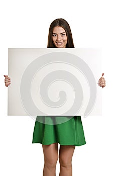 Young girl with empty sheet of paper