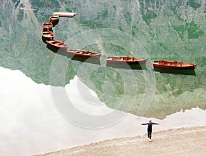 Young girl enjoying the autumn scenery of Lake Braies