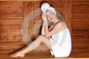 Young girl enjoying sauna photo