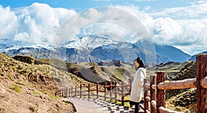 Young girl enjoys the view of valley on road