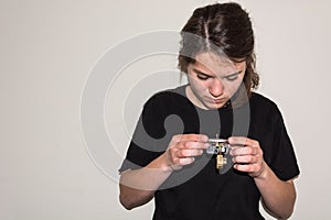 Young girl examinating a damaged electric socket