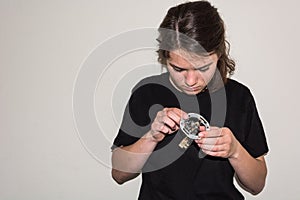 Young girl examinating a damaged electric socket photo