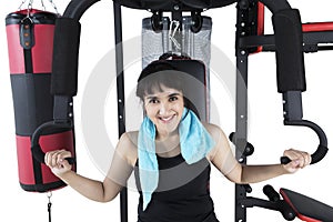 Young girl exercising on weights machine