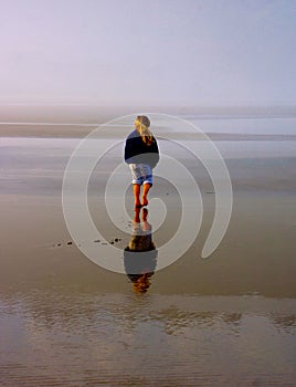 Young Girl Explores Empty Beach