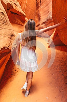 Young girl exploring Antilope Canyon in Arizona. Antilope canyon the most beautiful canyon in USA