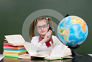 Young girl exploring the globe