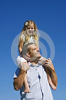 Young girl on Fathers Shoulders