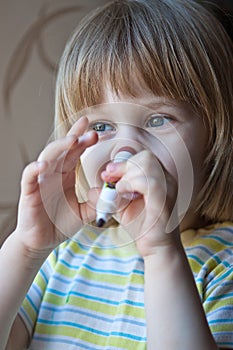 Young girl with felt-tip pen