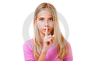 Young girl with finger on lips as concept of ordering silence.I