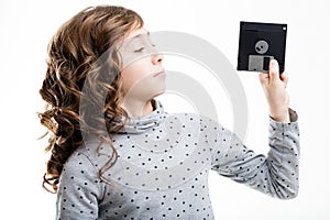 Young girl with floppy disk