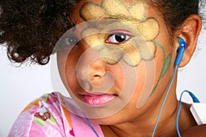 Young Girl with Flower on Face with Digital Music