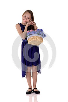 Young girl and flowers in a basket