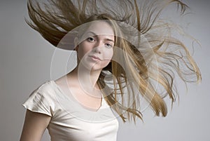 Young girl with flying fair hair